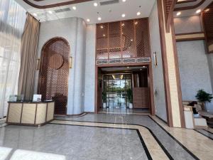 a lobby of a building with a hallway with a lobby at Oliver's vacation home - Vinhomes Grand Park in Long Bình +28 photos