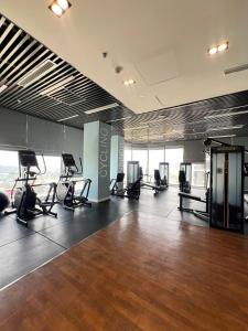 an empty gym with chairs in a large room at Oliver's vacation home - Vinhomes Grand Park in Long Bình