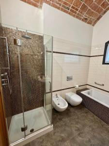 a bathroom with a shower and a toilet and a sink at Casa Barovaldo in Zola Predosa +27 photos