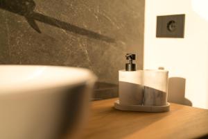 a couple of candles sitting on a wooden table at DN ART BLEVIO - Romantic Lake Como Apartment with Indoor Jacuzzi - 5 guests in Blevio +33 photos