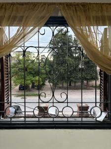 an open window with a view of a park at Jerarquizado M Rentals in Santiago del Estero