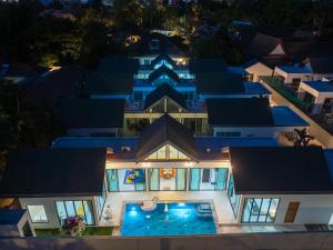an aerial view of a villa at night at Yuan Villa VIP in Rawai Beach