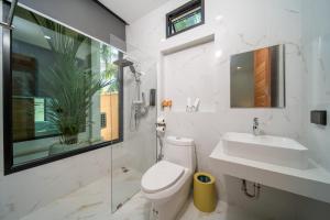a bathroom with a toilet and a sink at Yuan Villa VIP in Rawai Beach +36 photos