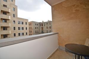 a room with a table and a view of buildings at Apartments by MR Yeravan in the city centre in Yerevan