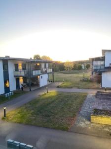 a view of a building with a lawn in front of it at Nära strand och hav in Halmstad