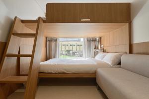 a bedroom with a bunk bed with a window at Hotel On You in Seoul +183 photos