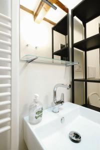 a bathroom with a sink and a mirror at historical townhome in Poppi in Poppi