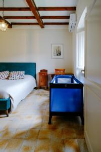 a bedroom with a bed and a pool table at historical townhome in Poppi in Poppi