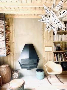 a room with a chair and stars on the wall at Respiro in Paris