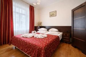 a hotel room with a bed with towels on it at Hotel Restauracja Caspar in Jelenia Góra
