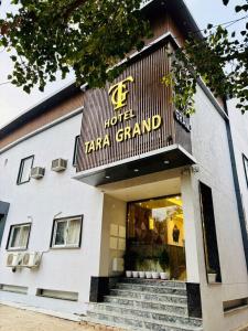 a building with a sign that reads taranzai grand at Hotel Tara Grand in Mathura