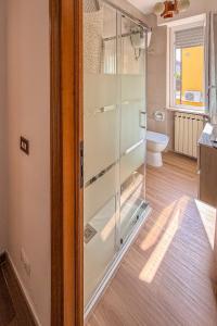a glass shower in a bathroom with a toilet at Da Nonna Mena in Fossacesia