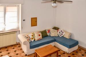 a living room with a couch with pillows on it at Da Nonna Mena in Fossacesia +40 photos