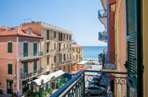 a view of the ocean from a balcony at Hotel Mimosa in Alassio