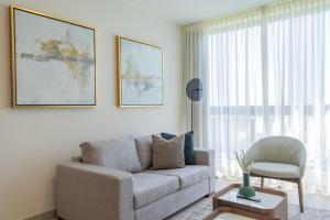 a living room with a couch and a chair at Condo Suite 2BR With View in Panama City