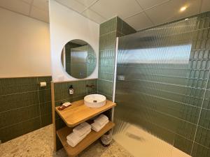 a bathroom with a shower and a sink and a mirror at Urban Style L'Etape in Saint-Flour +106 photos