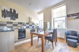 a kitchen with a wooden table and a dining room at 2 Bed in Richmond oc-ds187 in Richmond