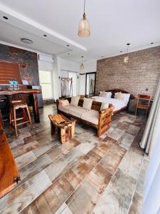 a living room with a couch and a table at City Retreat Mega in Arusha