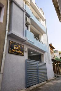 a sign on the side of a building at SRT Homes Ranchi in Rānchī