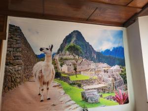 a llama standing in front of a painting on a wall at Hotel Eisenbahn - Peruanisches Restaurant - Zentral in Karlstadt-Fahrradfahrer- und Familienfreundlich in Karlstadt