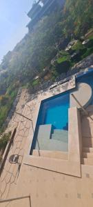 an overhead view of a swimming pool on a building at الريف الاوربي in Cairo
