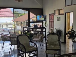 a lobby with chairs and a desk with a computer at Fortuna garden hotel in Fortuna