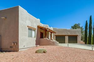 a house with a rock in front of it at Golfer's Haven! Mtn-View Dewey Gem w/ Pool Access in Dewey
