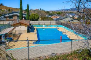 an overhead view of a swimming pool behind a fence at Golfer's Haven! Mtn-View Dewey Gem w/ Pool Access in Dewey