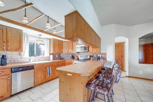 a kitchen with wooden cabinets and a wooden counter top at Golfer's Haven! Mtn-View Dewey Gem w/ Pool Access in Dewey