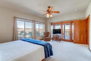 a bedroom with a bed and a ceiling fan at Golfer's Haven! Mtn-View Dewey Gem w/ Pool Access in Dewey +25 photos