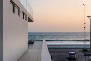 a view of the ocean from a building at Luxurious 2 bedroom condo with partial ocean view in Mazatlán