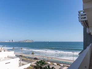 a view of the ocean from a building at Luxurious 2 bedroom condo with partial ocean view in Mazatlán