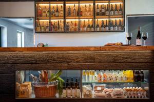 a bar with many bottles of wine and drinks at Farmors Lycka in Kivik