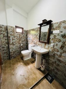 a bathroom with a toilet and a sink at Dream Arch ella in Demodera