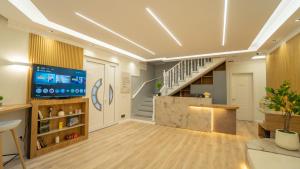 a large room with a staircase and a stair case at 7even Boutique Hostel in Tirana
