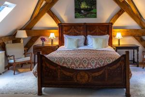 a bedroom with a large bed in a attic at Wooden Cabbage Barn in Dorchester
