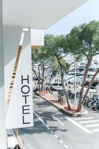 a street with a sign that reads open at Boutique Hotel Miramar in Monte Carlo +59 photos