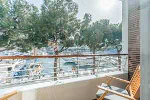 a balcony with a view of a boat at Boutique Hotel Miramar in Monte Carlo