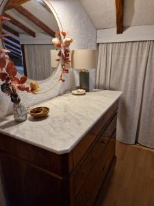 a bathroom counter with a mirror and a sink at Charming house just a few minutes from the beach in Sainte-Maxime +25 photos
