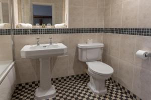 a bathroom with a toilet and a sink at Ringwood Hall Hotel & Spa, Best Western Signature Collection in Chesterfield