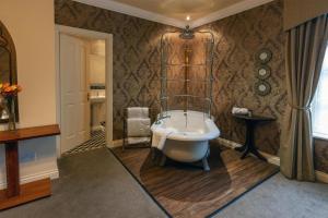 a bathroom with a bath tub in a room at Ringwood Hall Hotel & Spa, Best Western Signature Collection in Chesterfield +78 photos