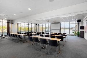 a conference room with tables and chairs and a whiteboard at Best Western St Svithun Hotell in Stavanger