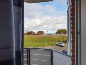 a view from a window of a car parked in a parking lot at FeWo Krüger 17 in Dahme