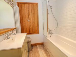 a bathroom with a tub and a sink and a shower at Wayside Farm in Richmond +42 photos
