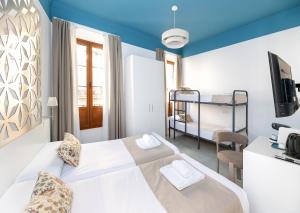 a bedroom with a bed and a bunk bed at Nest Style Granada in Granada