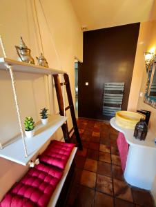 a room with a bed and shelves in a room at Le Cocon Des Arcades - Central, charmant balcon - in Limoux +22 photos