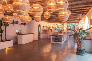 a room with many baskets hanging from the ceiling at Deluxe Rooms Pet Friendly in Fethiye