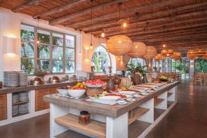 a large kitchen with a long buffet of food at Deluxe Rooms Pet Friendly in Fethiye