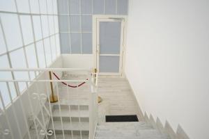 a staircase with a white door in a room at FM Pompeii in Pompei