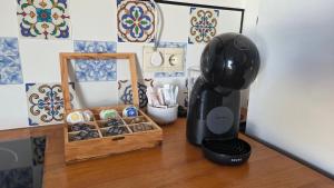 a black blender sitting on a counter next to a box of cookies at Ático Vista La Sierra in Jarandilla de la Vera +6 photos